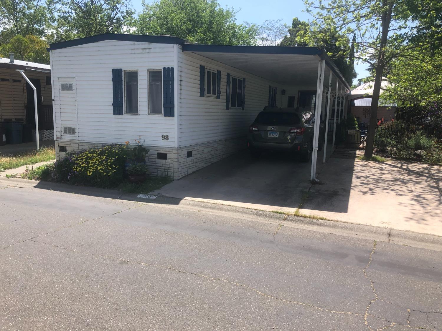 a front view of a house with yard