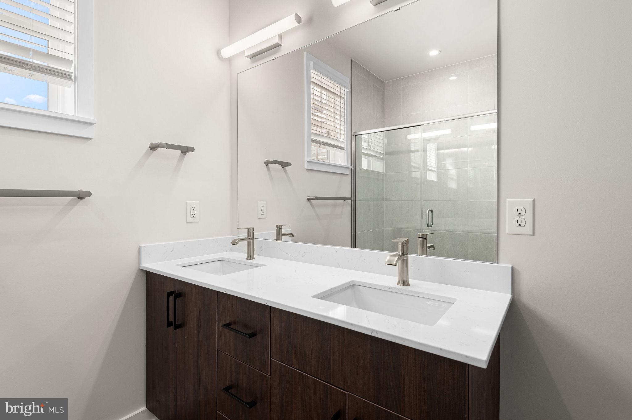 26 South York Road, Unit 409 Hatboro, PA 19040 - Photo 10 of 16 Sleek modern bathroom with dual sinks.