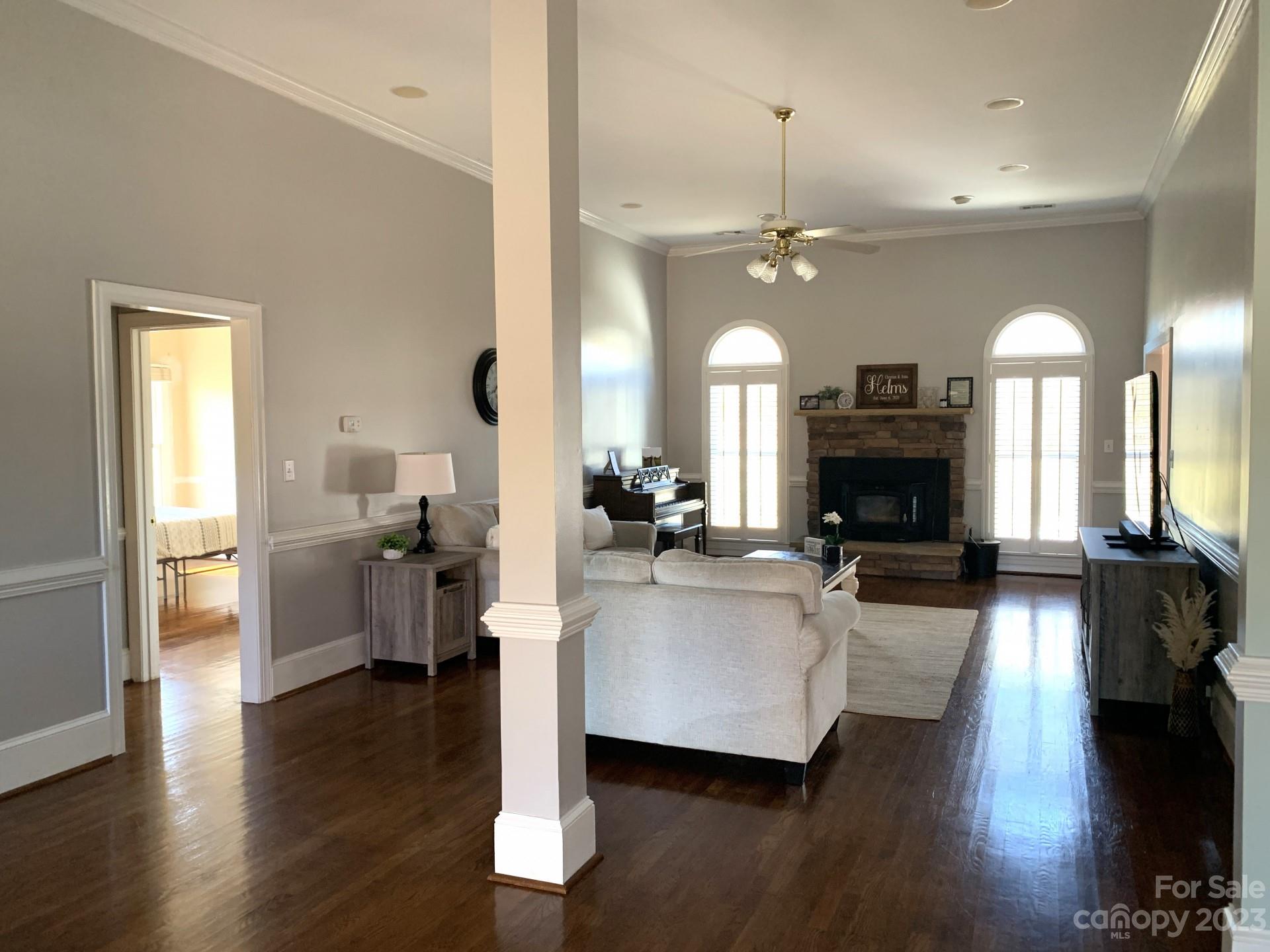 1026 Snyders Store Road Wingate, NC 28174 - Photo 11 of 34 a living room with furniture fireplace and wooden floor