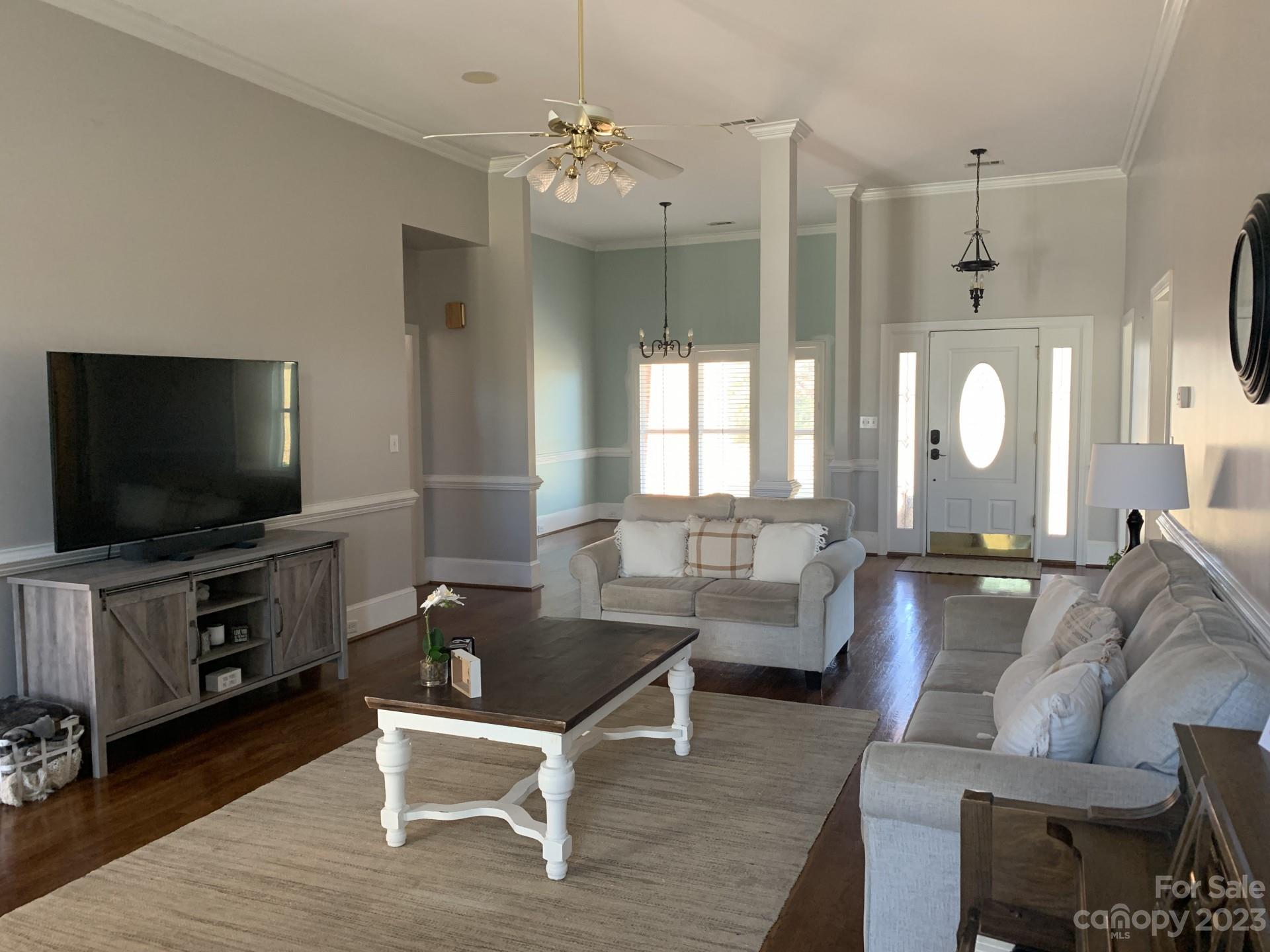 1026 Snyders Store Road Wingate, NC 28174 - Photo 12 of 34 a living room with furniture and a flat screen tv