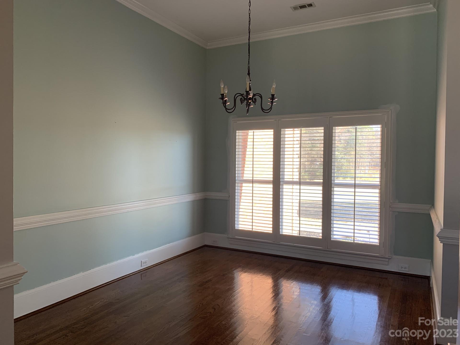 1026 Snyders Store Road Wingate, NC 28174 - Photo 13 of 34 a view of an empty room with wooden floor and a window