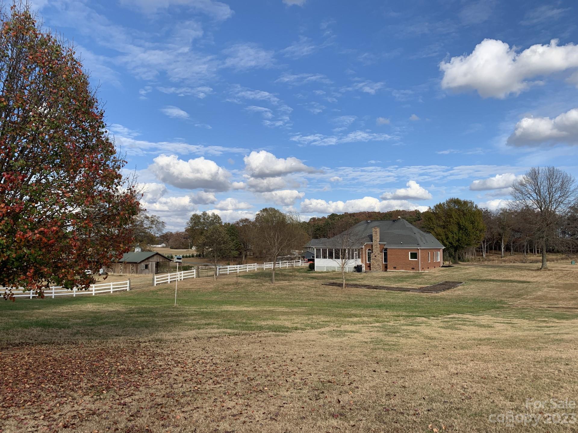 1026 Snyders Store Road Wingate, NC 28174 - Photo 3 of 34 a view of a lake with houses