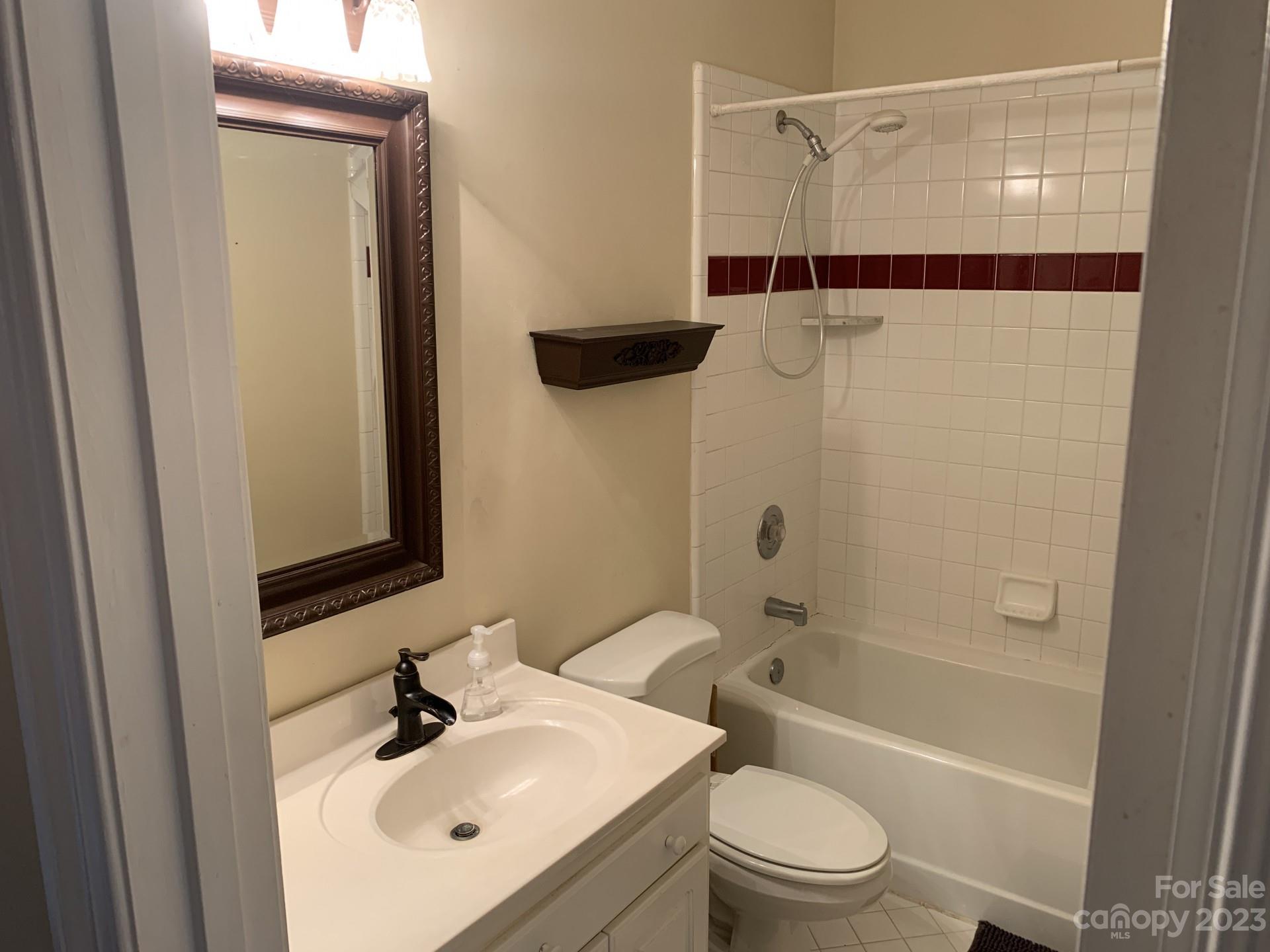 1026 Snyders Store Road Wingate, NC 28174 - Photo 32 of 34 a bathroom with a sink a toilet and shower