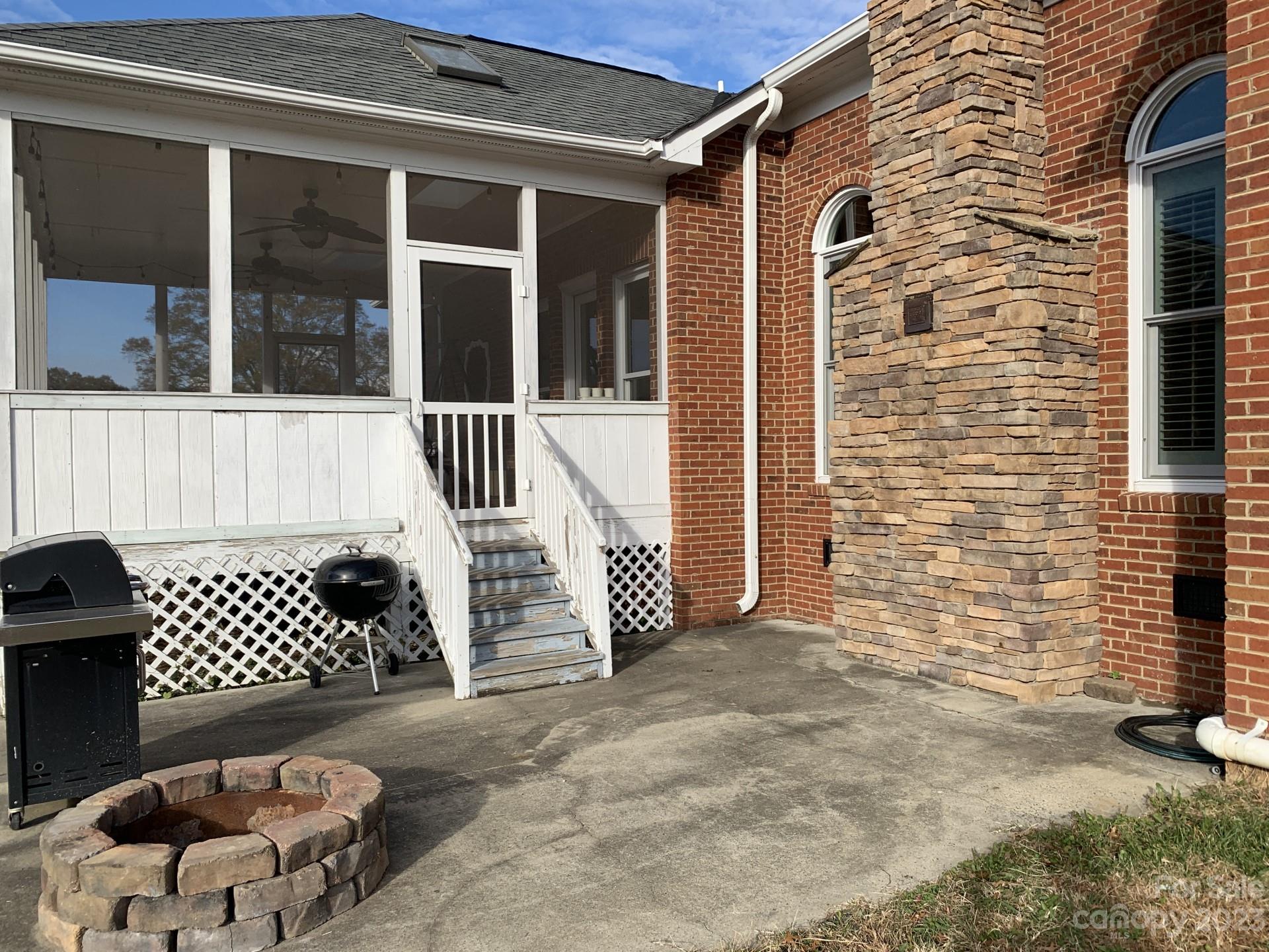 1026 Snyders Store Road Wingate, NC 28174 - Photo 4 of 34 a view of a porch with a chair