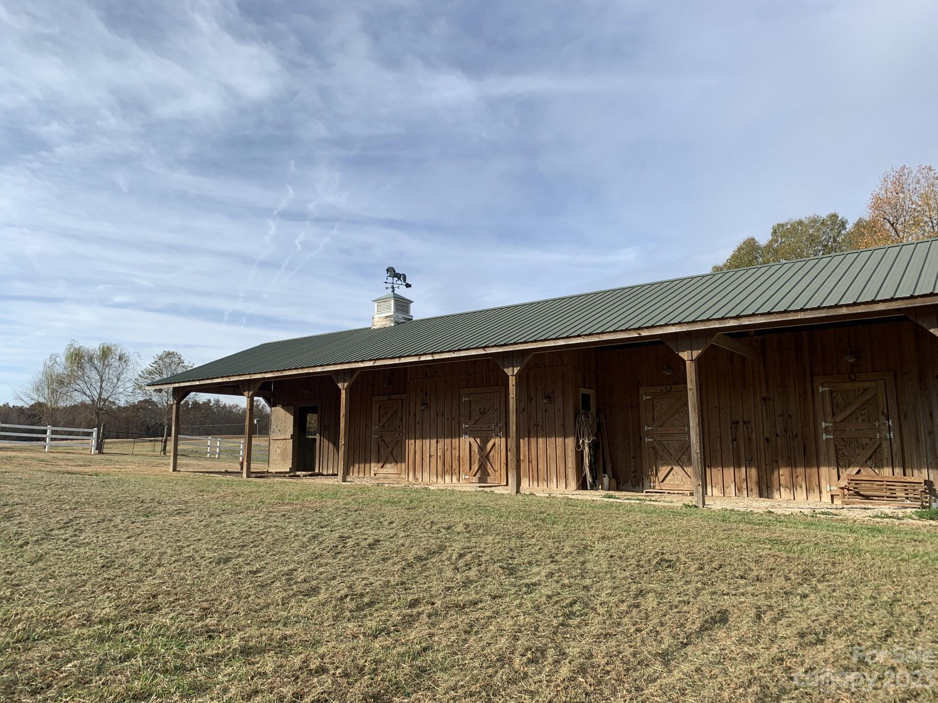 1026 Snyders Store Road Wingate, NC 28174 - Photo 8 of 34 a front view of a house with a yard