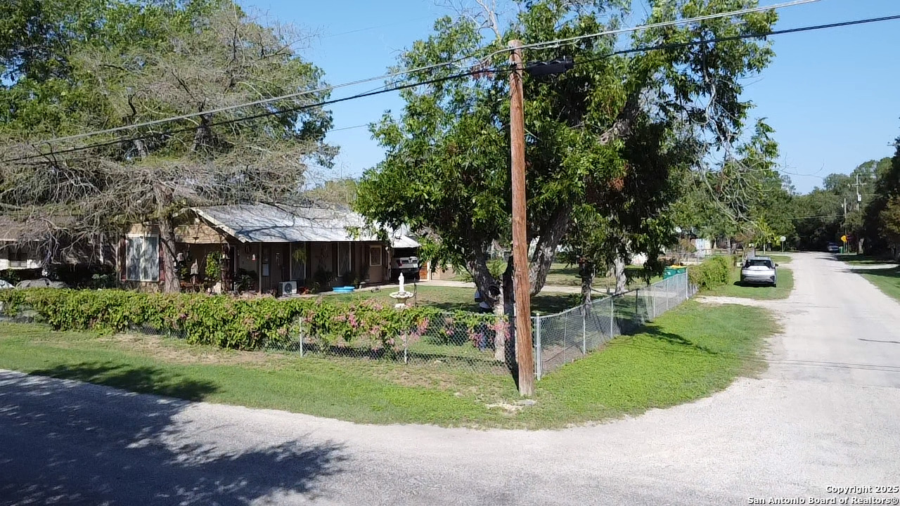 601 Berlin Street Castroville, TX 78009 - Photo 16 of 17 a front view of a house with a yard