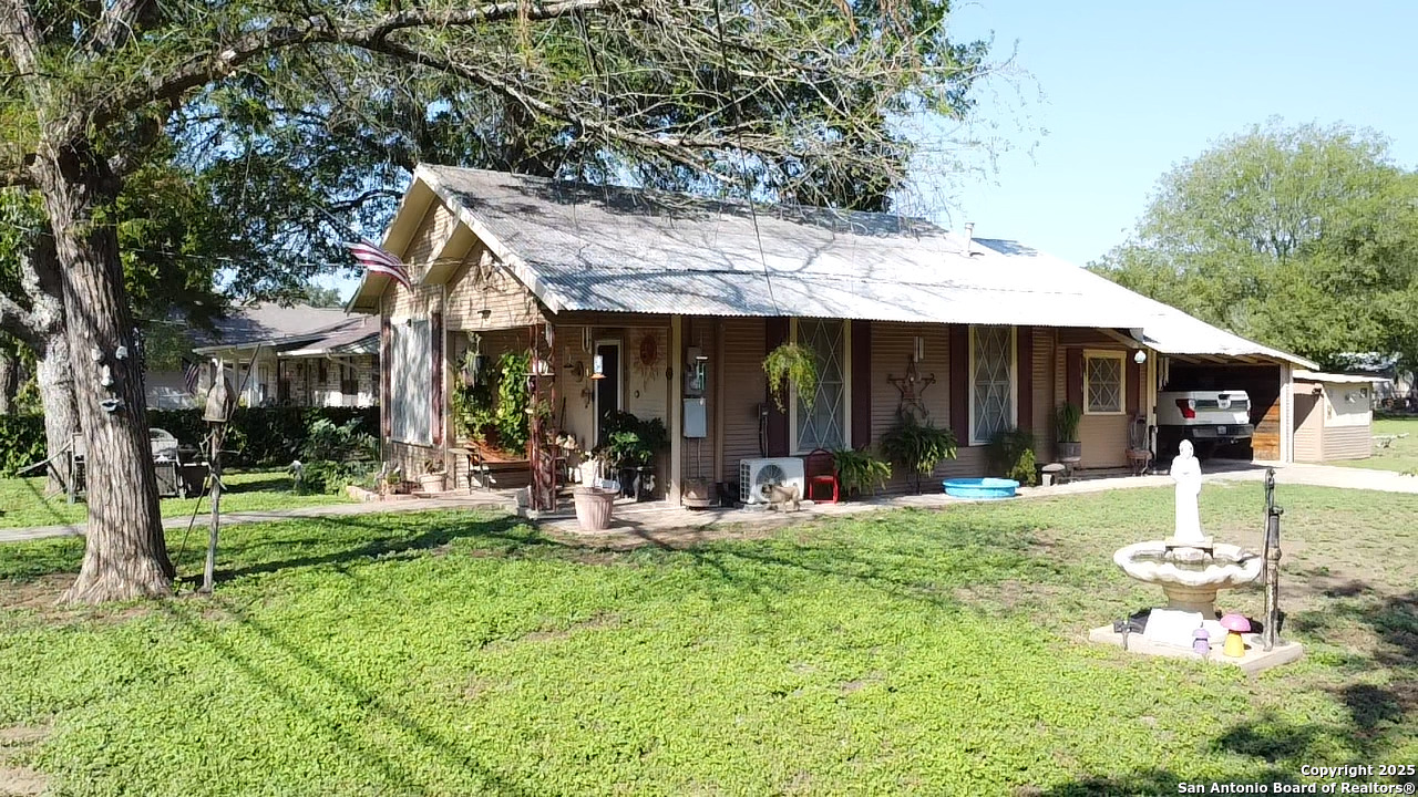 601 Berlin Street Castroville, TX 78009 - Photo 17 of 17 a view of a house with backyard porch and sitting area
