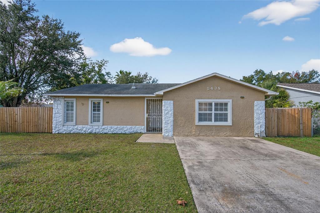 5438 Snowflake Court Orlando, FL 32839 - Photo 1 of 38 a view of a house with a yard and potted plants
