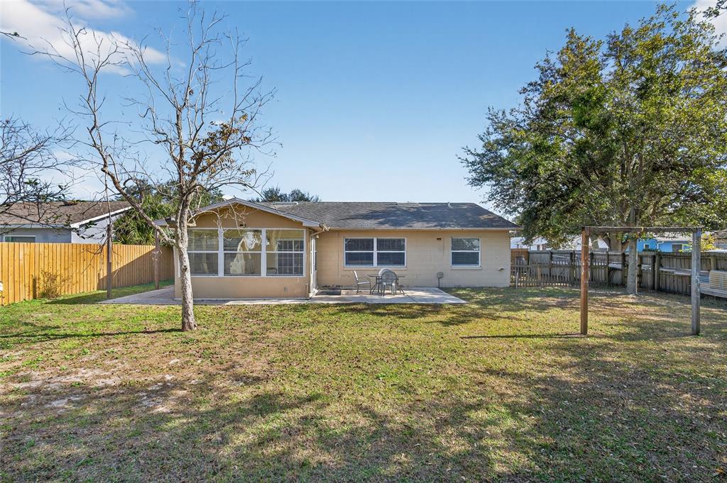 5438 Snowflake Court Orlando, FL 32839 - Photo 13 of 38 a house that has a tree in front of it