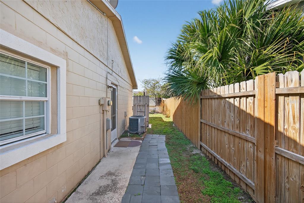 5438 Snowflake Court Orlando, FL 32839 - Photo 14 of 38 a view of a pathway of a house with a yard