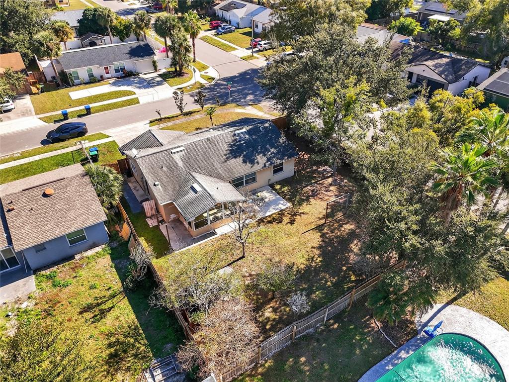 5438 Snowflake Court Orlando, FL 32839 - Photo 18 of 38 an aerial view of a swimming pool with outdoor seating