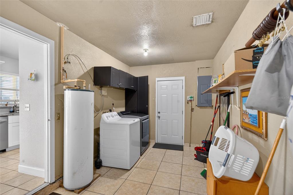 5438 Snowflake Court Orlando, FL 32839 - Photo 27 of 38 a view of living room with furniture and washer dryer