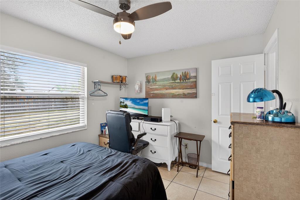 5438 Snowflake Court Orlando, FL 32839 - Photo 30 of 38 a bedroom with furniture and a window