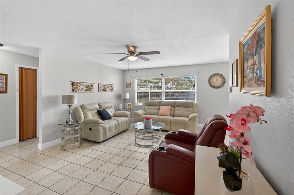 5438 Snowflake Court Orlando, FL 32839 - Photo 3 of 38 a living room with furniture and a window