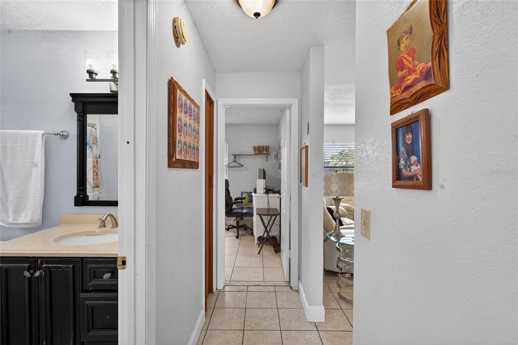5438 Snowflake Court Orlando, FL 32839 - Photo 32 of 38 a view of a bathroom from the hallway