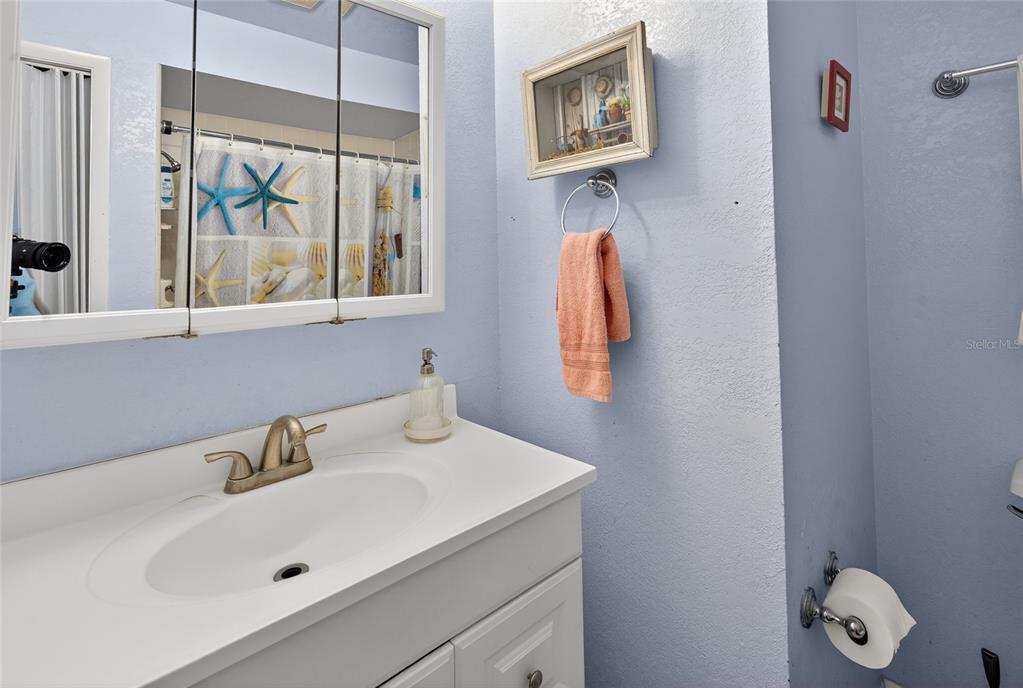 5438 Snowflake Court Orlando, FL 32839 - Photo 36 of 38 a bathroom with a sink and a window