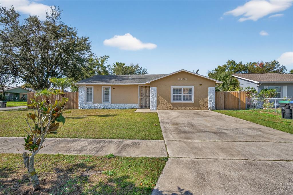 5438 Snowflake Court Orlando, FL 32839 - Photo 8 of 38 a view of house with outdoor space and garden