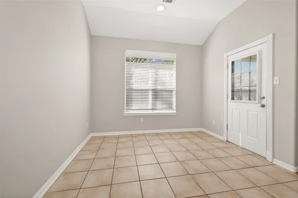 a view of an empty room and window