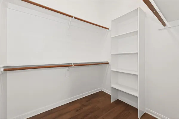 a view of an empty walk in closet