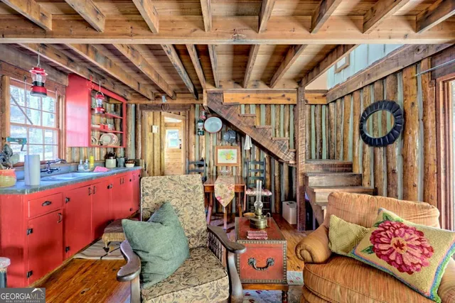 a view of an entryway with wooden floor