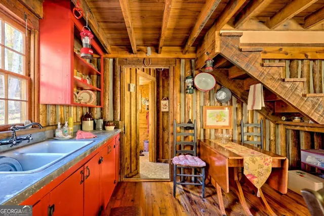 a view of a room with wooden floor