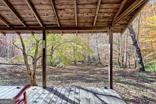 a backyard of a house with lots of trees