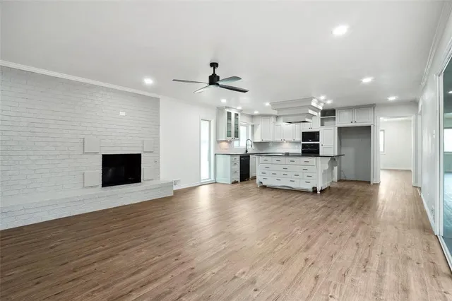 a view of a kitchen with a sink and a stove top oven