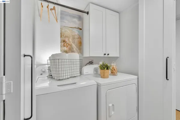 a bedroom with furniture and a potted plant