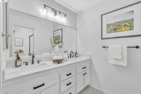 a white toilet sitting next to a bathroom sink
