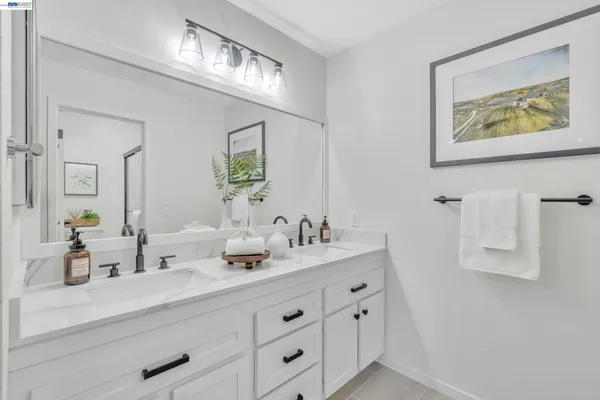 a white toilet sitting next to a bathroom sink