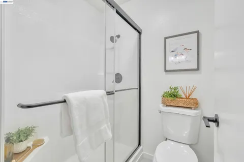 a bedroom with a bed and a lamp