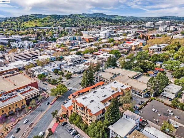 a front view of a building with parking
