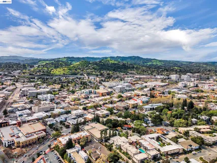 a city street lined with buildings and trees