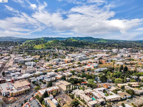 a city street lined with buildings and trees