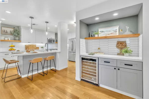 a kitchen with stainless steel appliances granite countertop a sink and cabinets