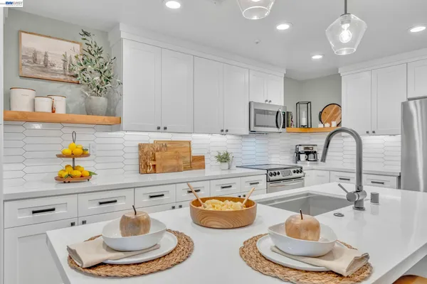 a kitchen with a sink and a stove