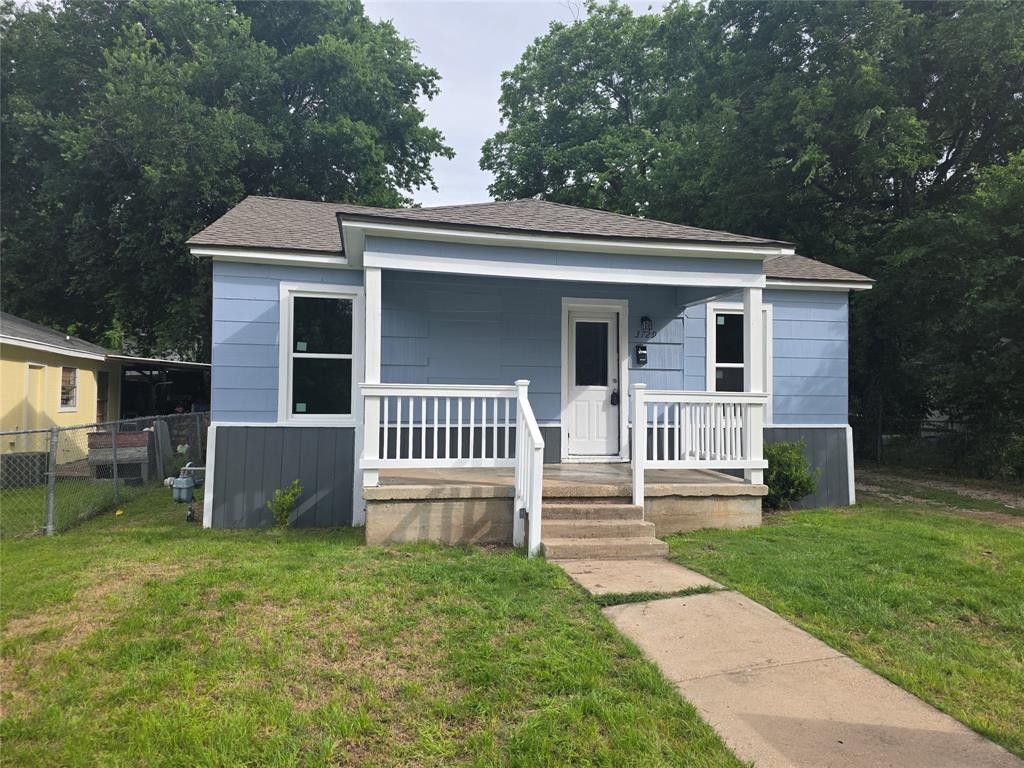 3729 Parrott Avenue Waco, TX 76707 - Photo 1 of 6 Single-story residence featuring light blue siding with a dark grey accent, a white front door, and a covered porch with white railings