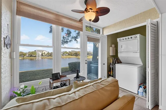 a room with furniture and a large window