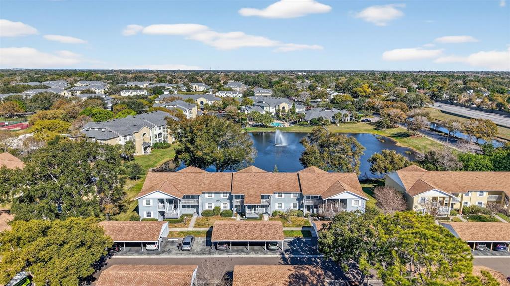 1438 Millstream Lane, Unit 105 Dunedin, FL 34698 - Photo 28 of 34 an aerial view of residential houses with outdoor space