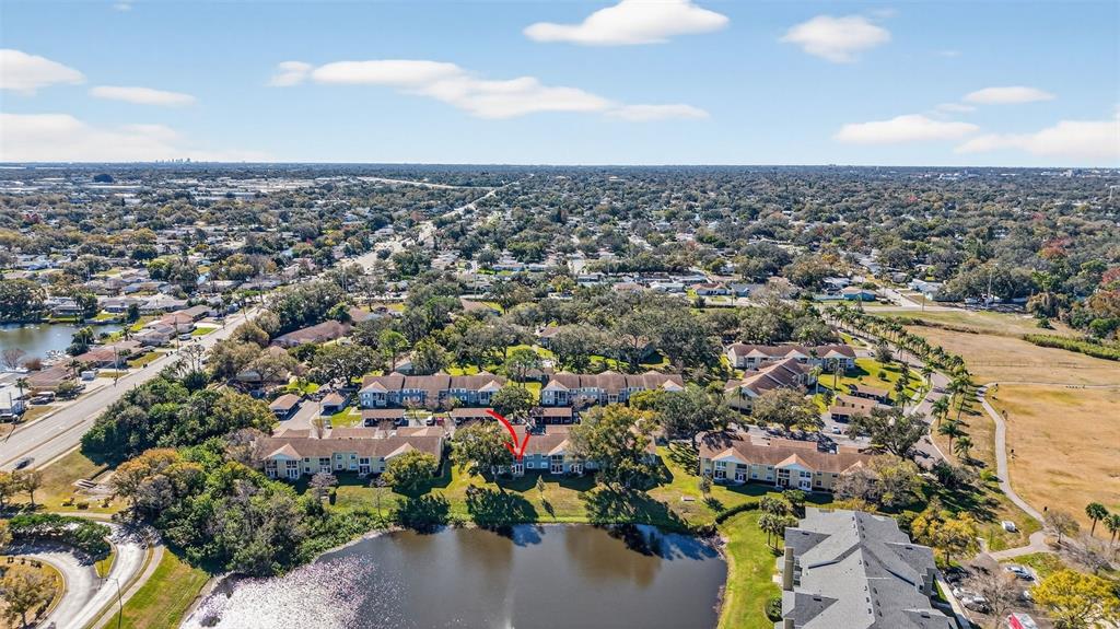 1438 Millstream Lane, Unit 105 Dunedin, FL 34698 - Photo 33 of 34 an aerial view of a city