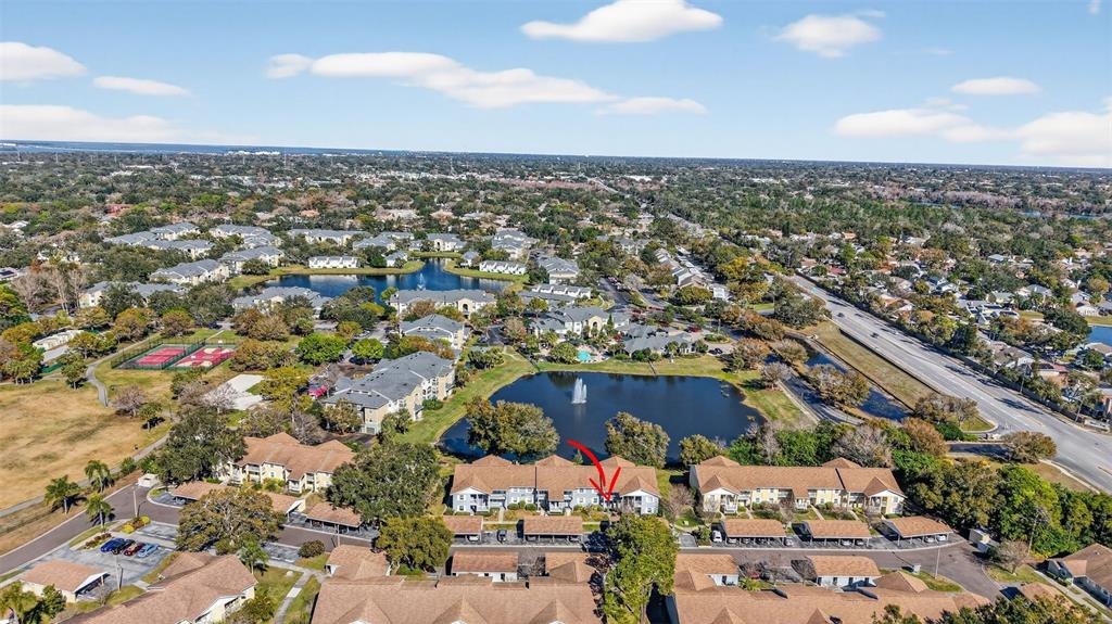 1438 Millstream Lane, Unit 105 Dunedin, FL 34698 - Photo 8 of 34 an aerial view of multiple house