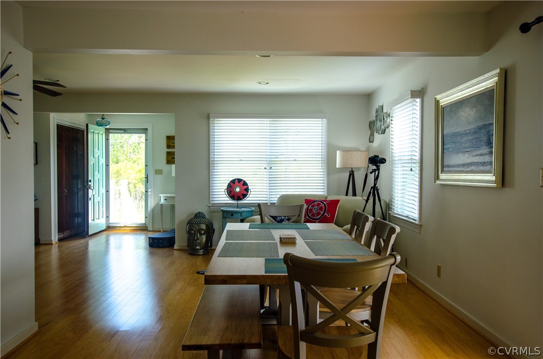 4773 Windmill Point Road White Stone, VA 22578 - Photo 17 of 36 a view of a dining room with furniture and a window