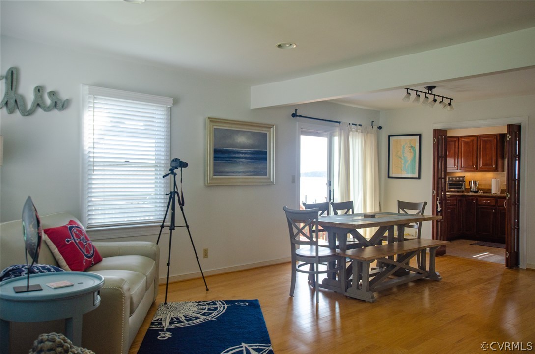 4773 Windmill Point Road White Stone, VA 22578 - Photo 18 of 36 a living room with furniture and wooden floor
