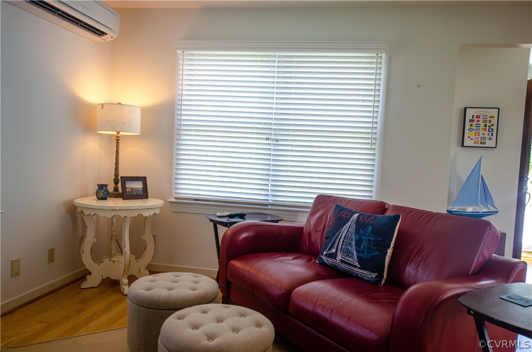 4773 Windmill Point Road White Stone, VA 22578 - Photo 19 of 36 a living room with furniture and a window