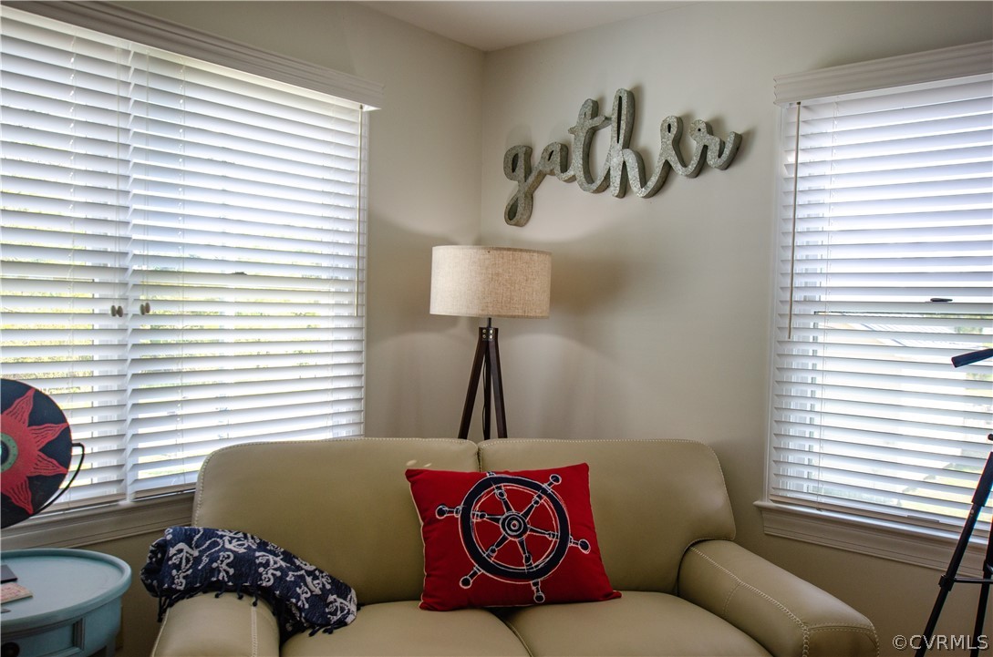 4773 Windmill Point Road White Stone, VA 22578 - Photo 20 of 36 a living room with a couch and a window
