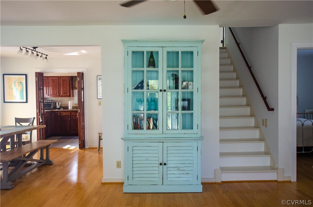 4773 Windmill Point Road White Stone, VA 22578 - Photo 21 of 36 a view of livingroom with furniture staircase and windows