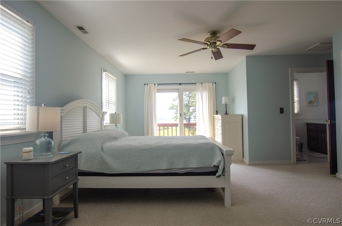4773 Windmill Point Road White Stone, VA 22578 - Photo 24 of 36 a bedroom with a bed and window