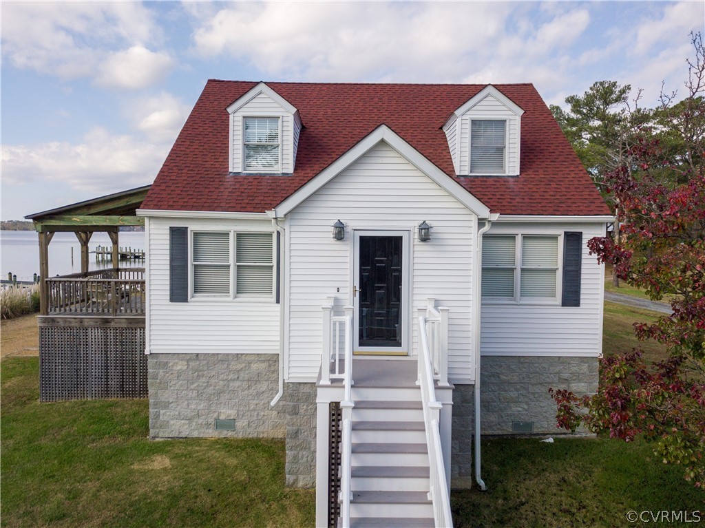4773 Windmill Point Road White Stone, VA 22578 - Photo 4 of 36 a front view of a house with a yard