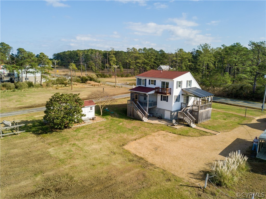 4773 Windmill Point Road White Stone, VA 22578 - Photo 6 of 36 a view of a swimming pool with a patio