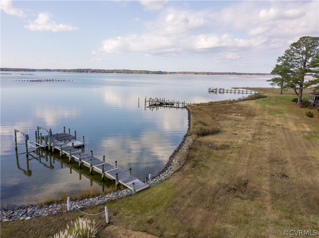 4773 Windmill Point Road White Stone, VA 22578 - Photo 7 of 36 a view of a swimming pool with an outdoor seating